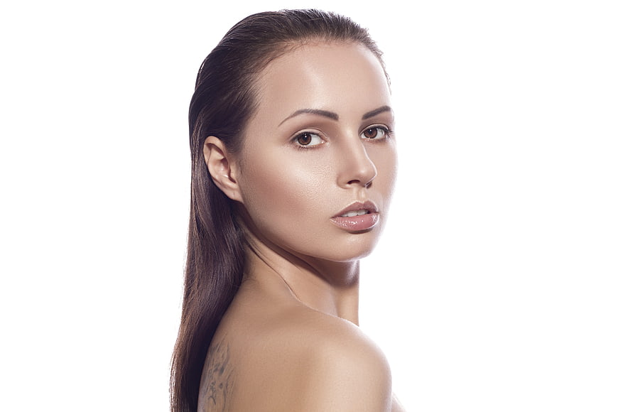 Studio Beauty Portrait Of Young Woman With Slicked Back Hair