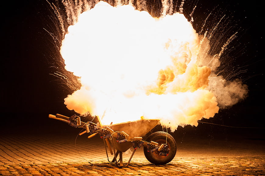 Explosion in Wheelbarrow with Fireworks and Sparks at Night