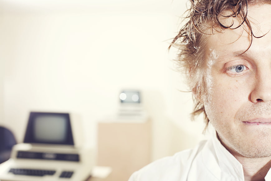 Stressed Programmer with Sweat and Retro Computer