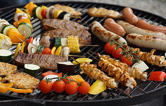 Assorted Grilled Meat and Vegetable Skewers on Charcoal Grill