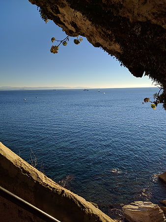 Scenic view of the Mediterranean Sea from a rocky cliff in Corsica