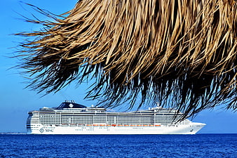 MSC Cruise Ship Viewed Through Thatched Palm Roof