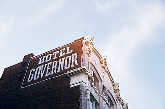 Low angle view of historic Hotel Governor brick building facade