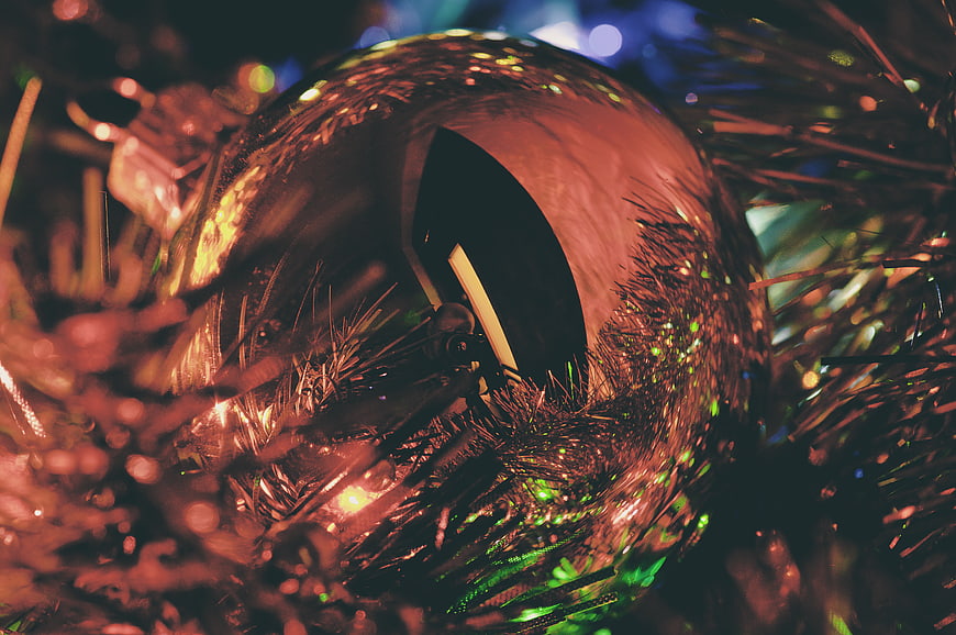 Close-up of shiny Christmas ornament in tinsel
