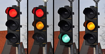 Sequence of traffic light signals showing red, yellow, and green phases