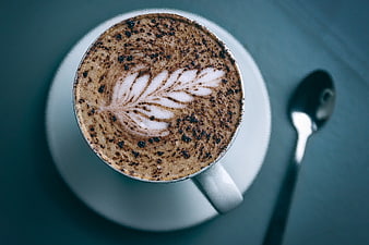 Top View Cappuccino with Latte Art and Spoon