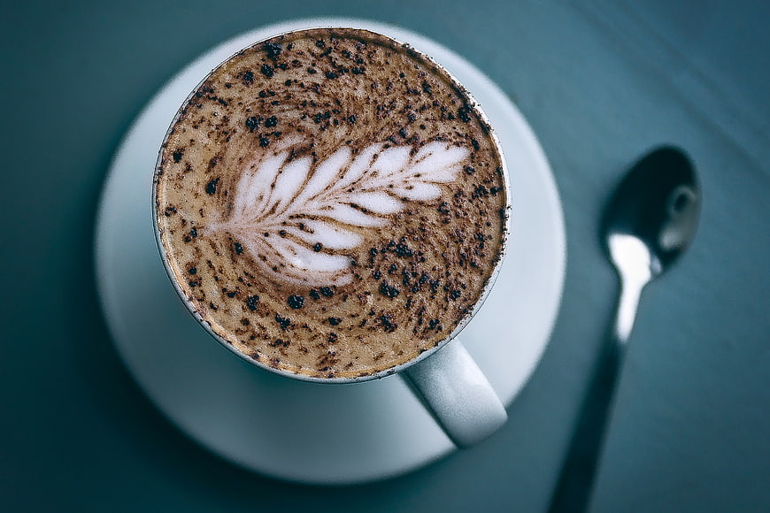 Top View Cappuccino with Latte Art and Spoon
