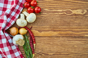 Fresh vegetables and herbs on wooden table with copy space
