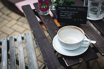 Empty Coffee Cup on Outdoor Wooden Table