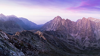 Majestic Mountain Peaks at Twilight with Purple Sky