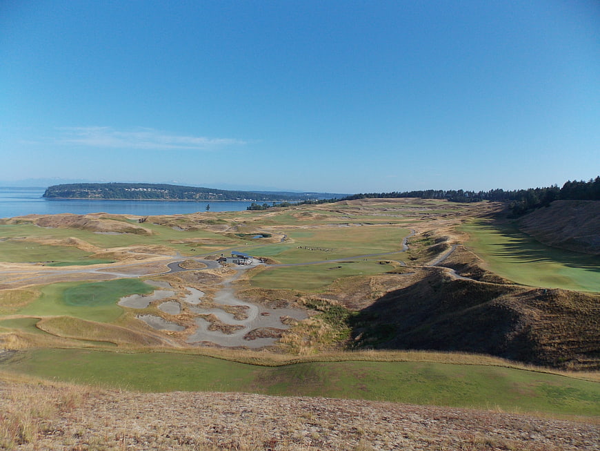 Aerial View of Coastal Golf Course with Ocean and Hills