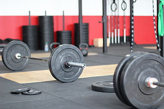 Barbell and Weight Plates in CrossFit Gym Environment