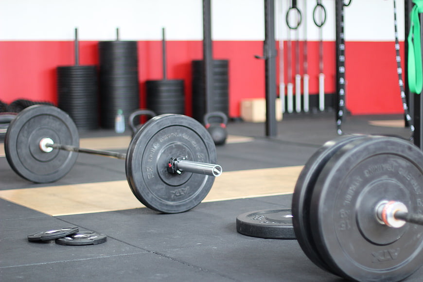 Barbell and Weight Plates in CrossFit Gym Environment