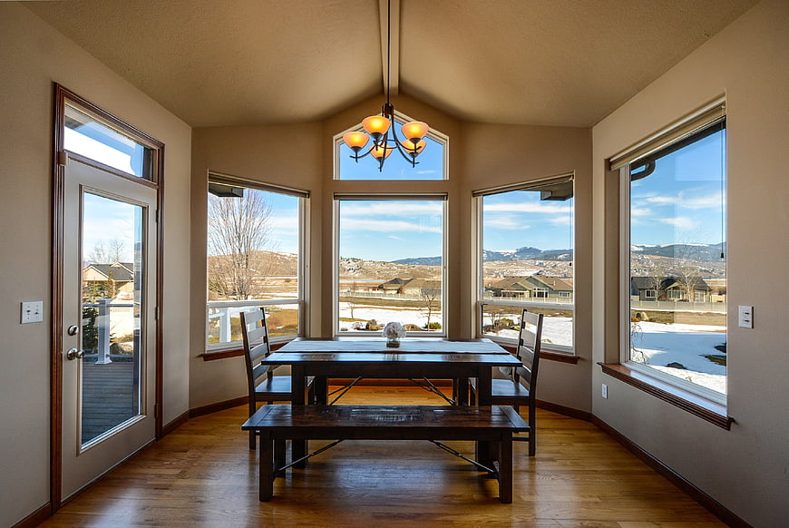 Bright dining room with mountain view and hardwood floors