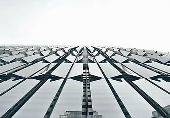 Low angle view of modern skyscraper glass facade