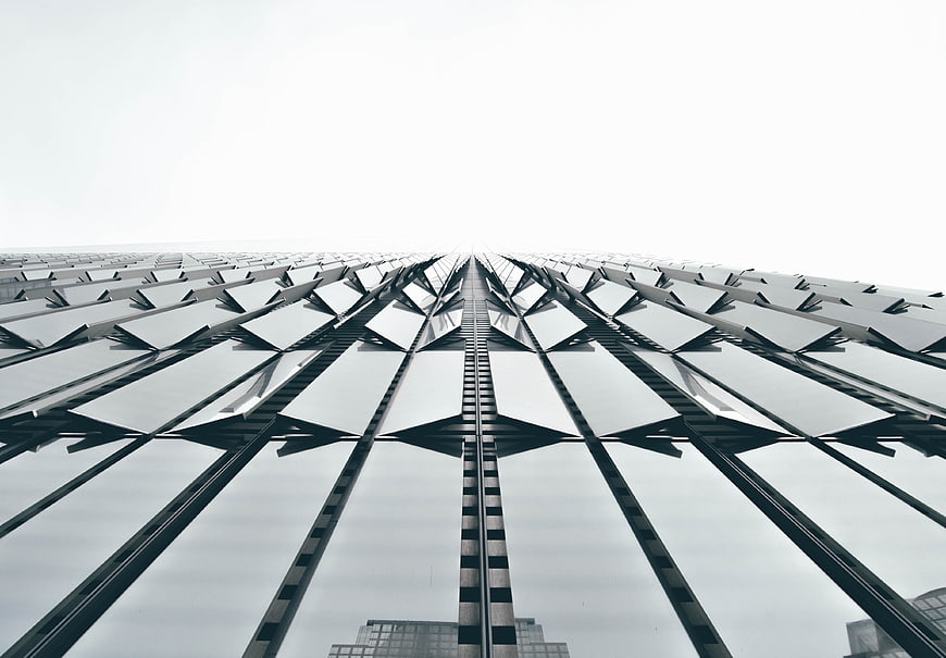 Low angle view of modern skyscraper glass facade