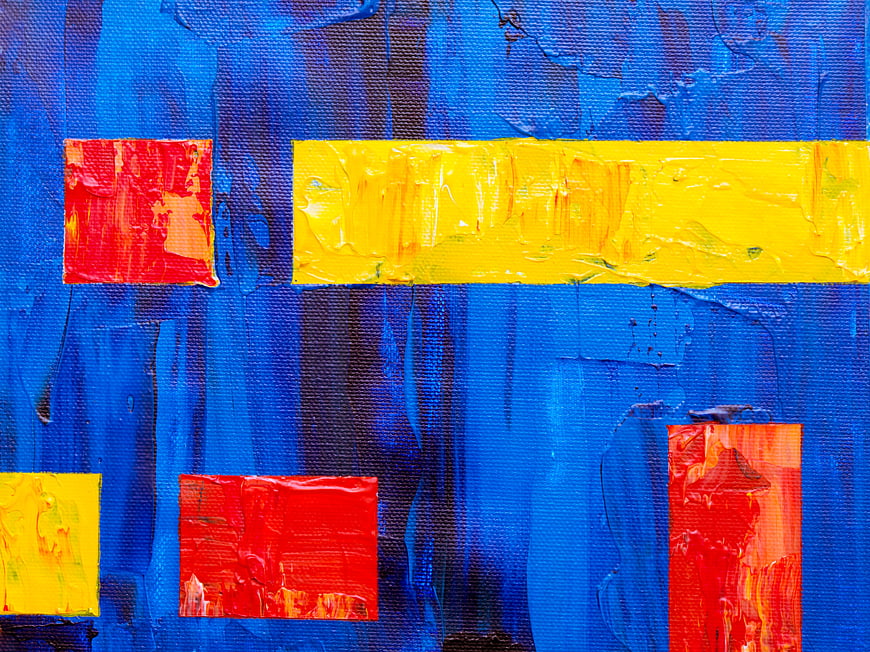 Abstract Blue Canvas with Red and Yellow Paint Blocks
