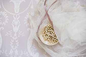 Elegant Wedding Veil with Pearls on Patterned Background