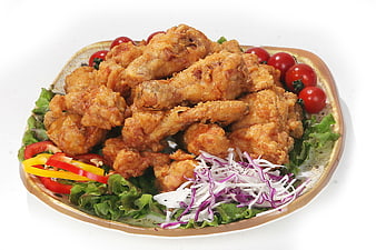 Crispy Fried Chicken Wings with Fresh Salad on White Background
