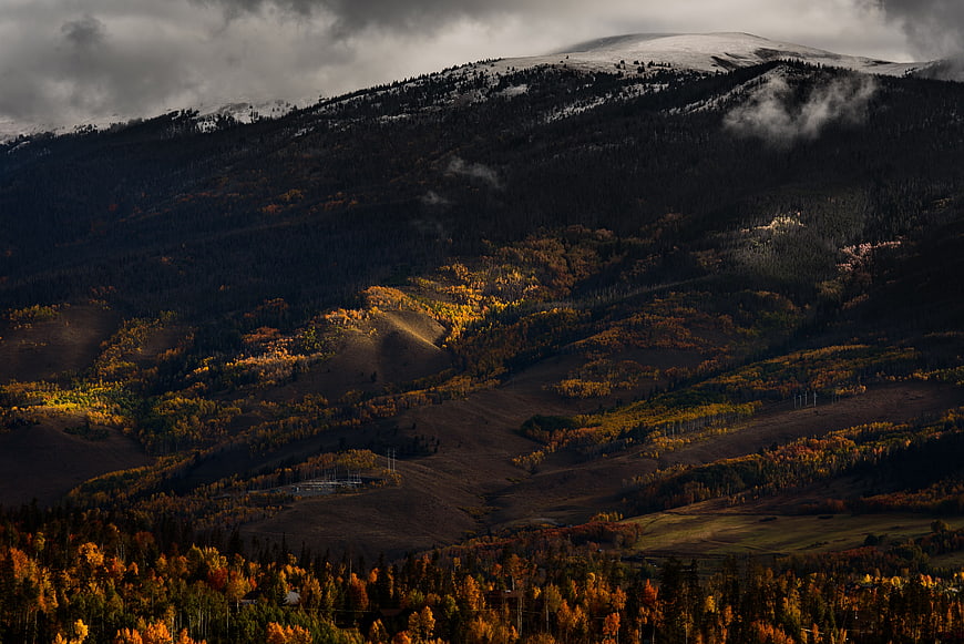 Dramatic Autumn Mountain Landscape with Snow-Capped Peaks