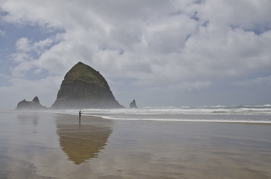 Lone Fisherman on Beach with Haystack Rock Reflection