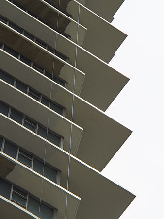 Low angle view of modern apartment building balconies