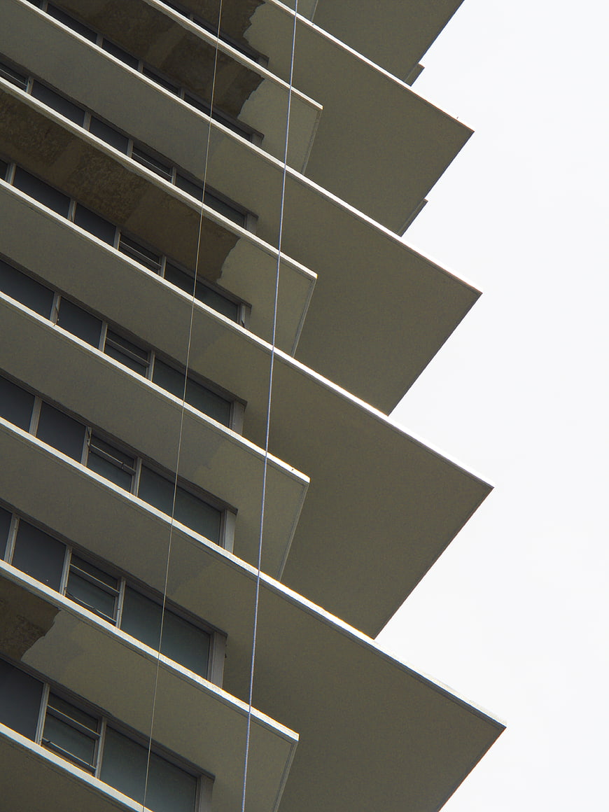 Low angle view of modern apartment building balconies