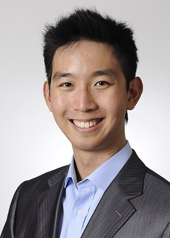 Portrait of smiling Asian businessman in suit