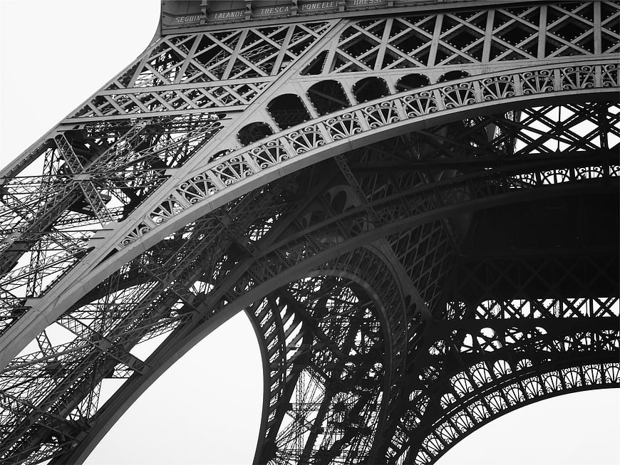 Black and white low angle view of Eiffel Tower ironwork