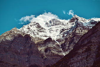 Majestic Snow-Capped Mountain Peak with Blue Sky