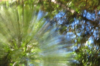 Abstract radiating green and blue water texture background