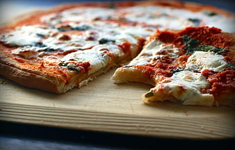 Homemade Margherita Pizza Slices on Wooden Board