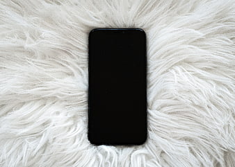 Black Smartphone Mockup on White Fluffy Fur Background