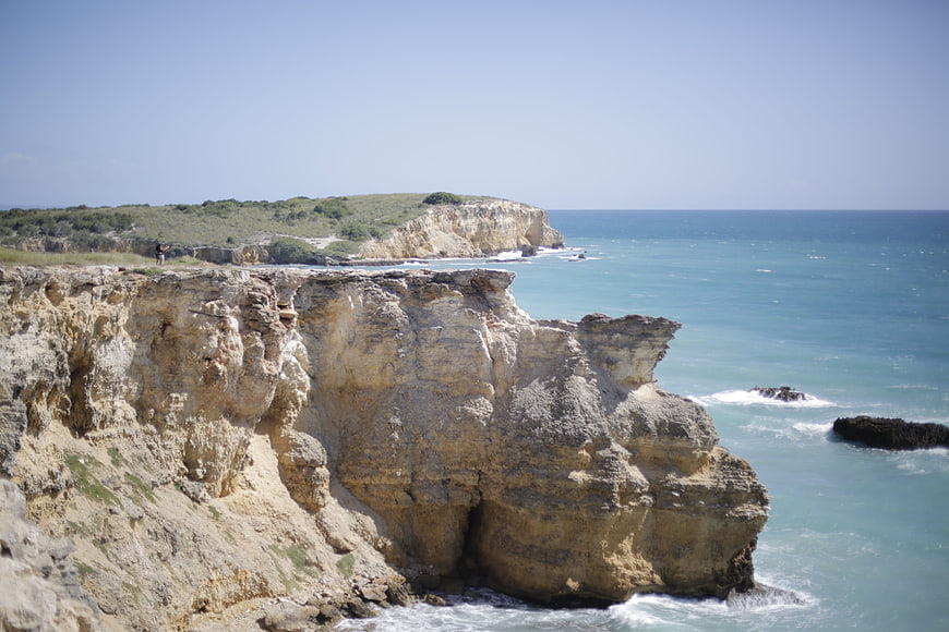 Dramatic coastal cliffs meeting turquoise ocean waters