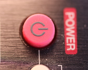 Close-up of red power button on remote control
