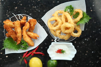 Overhead View of Fried Calamari and Chicken Fingers with Dipping Sauce