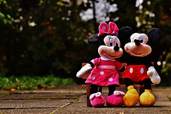 Mickey and Minnie Mouse Plush Toys Sitting on Miniature Wooden Bench