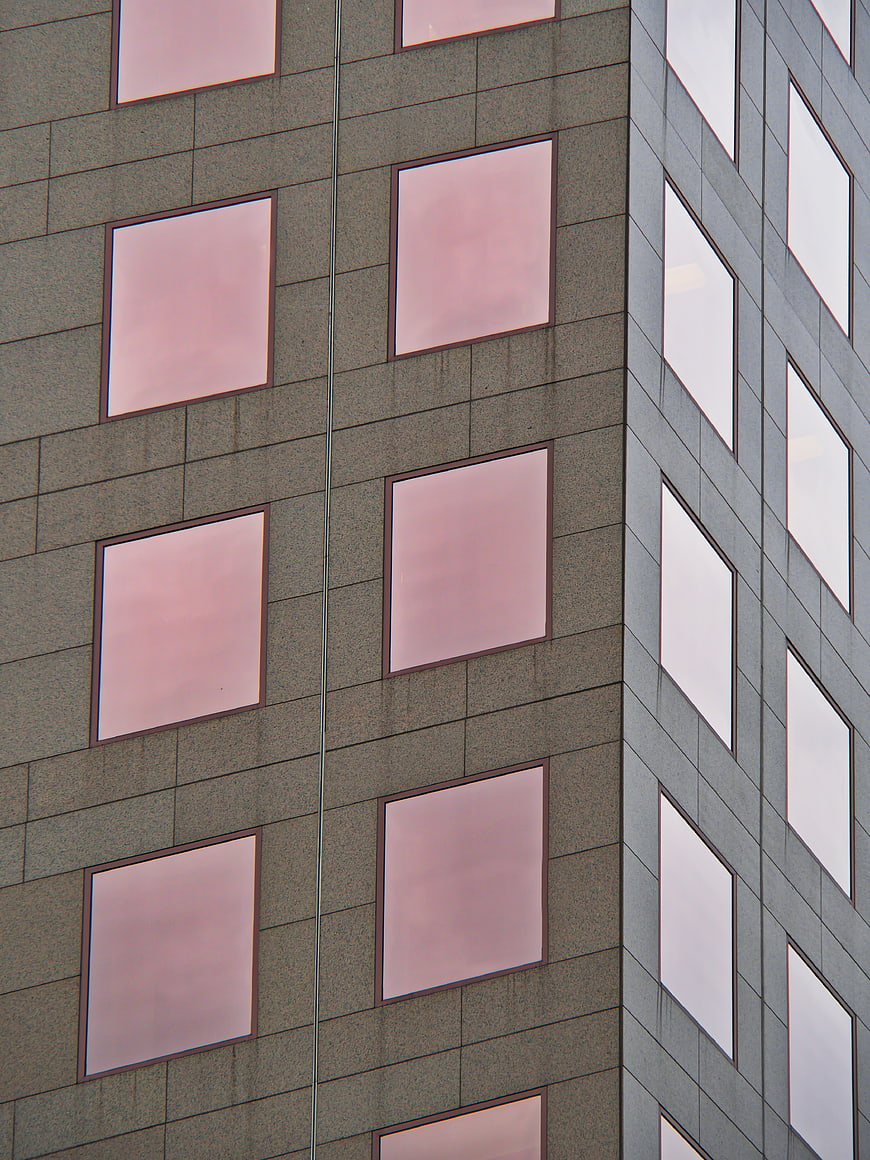 Modern Office Building Facade with Pink Reflections