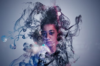 Artistic double exposure portrait of woman with smoke