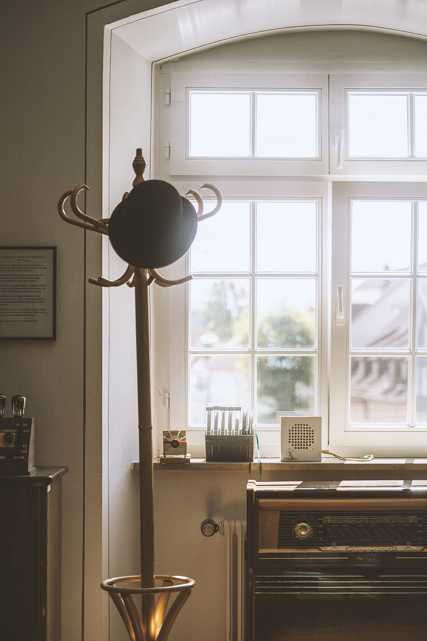 Vintage coat rack and retro radio by window