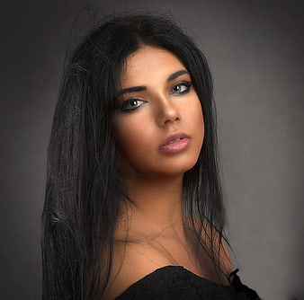 Studio Portrait of Woman with Long Black Hair and Makeup