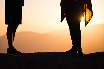 Silhouetted Couple Legs At Sunset