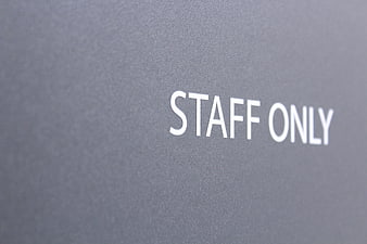 Staff Only Sign On Gray Wall