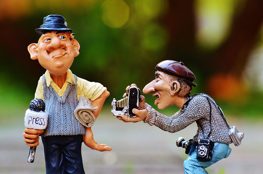Caricature Statues of Journalist and Photographer in Park