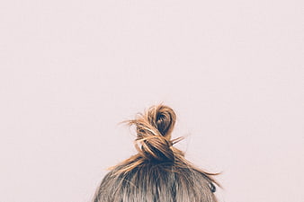 Messy Hair Bun on Minimalist Background