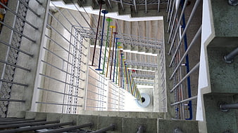Colorful Hanging Art Installation in Concrete Stairwell