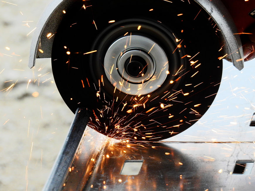 Angle Grinder Cutting Metal With Flying Sparks