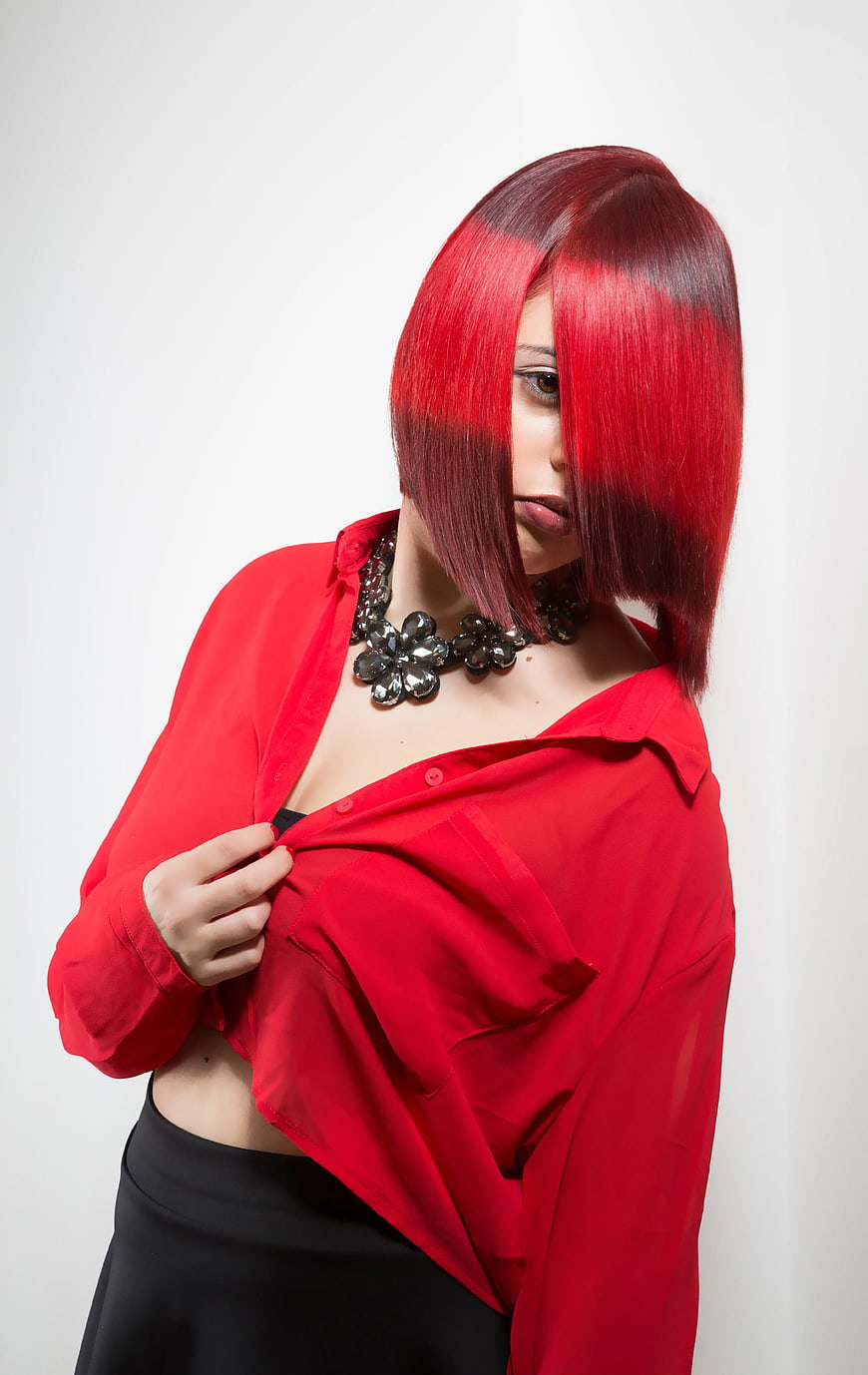 Woman with vibrant red hair and red shirt