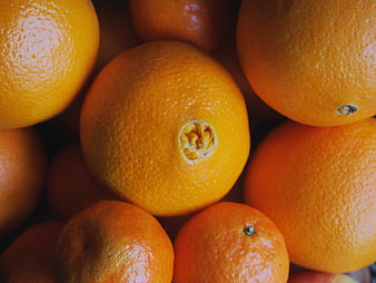 Close-up of fresh oranges with textured peel