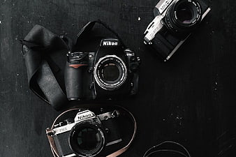 Vintage and Modern Cameras on Dark Background